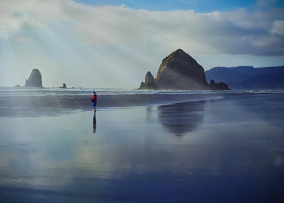 Solitary Light at Haystack Rock — color photograph by Jim Signorelli